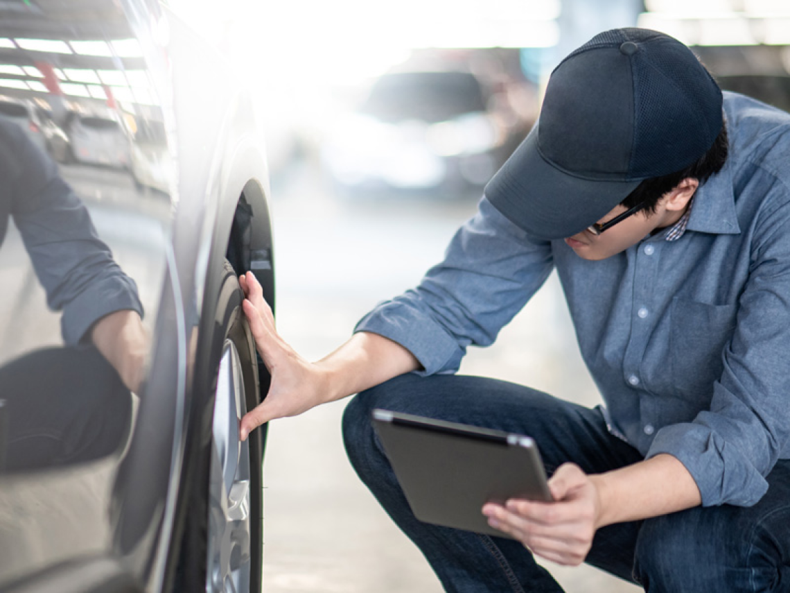 Man checking tyre